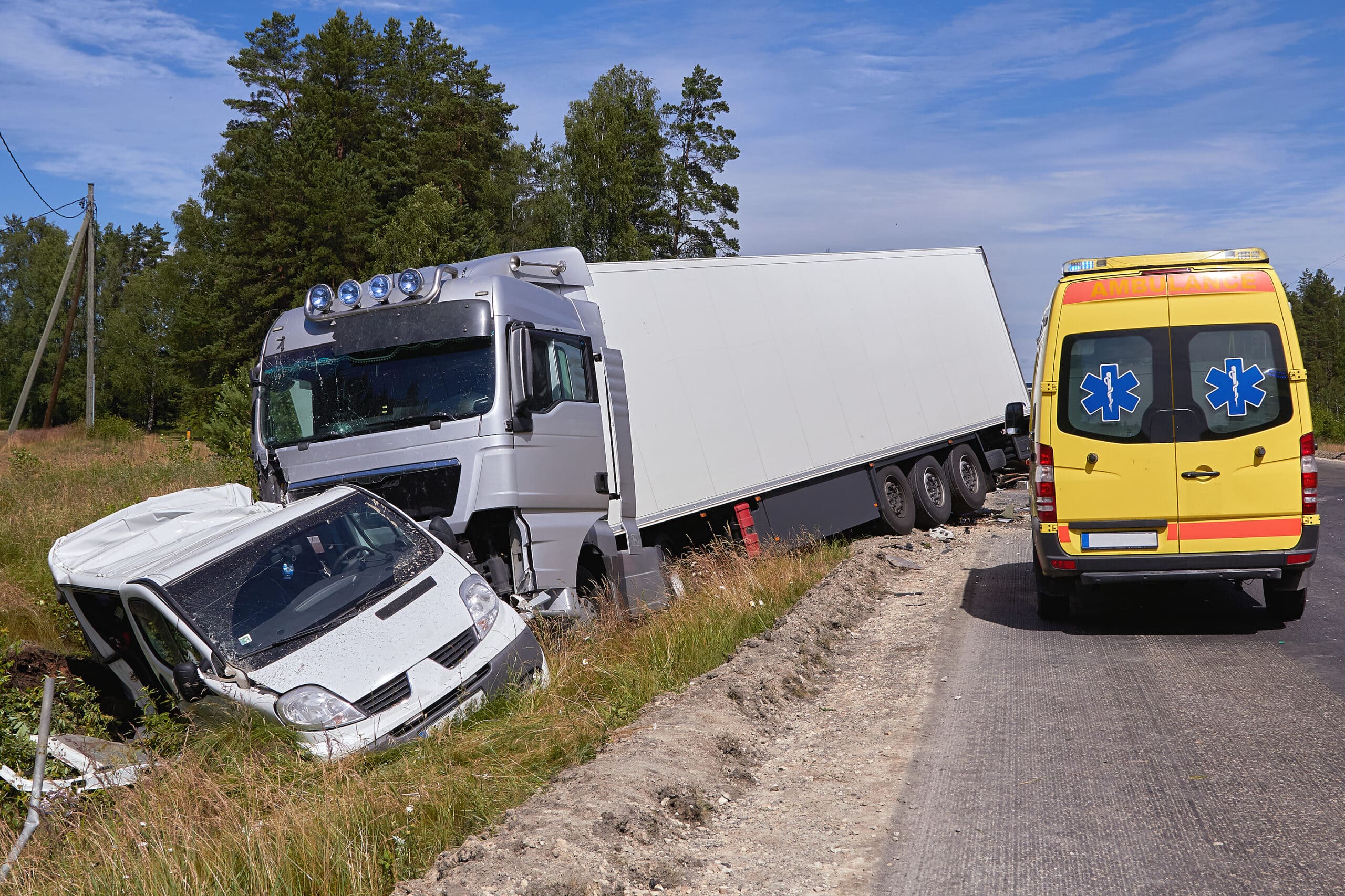 Van after a collision with a heavy truck on the highway